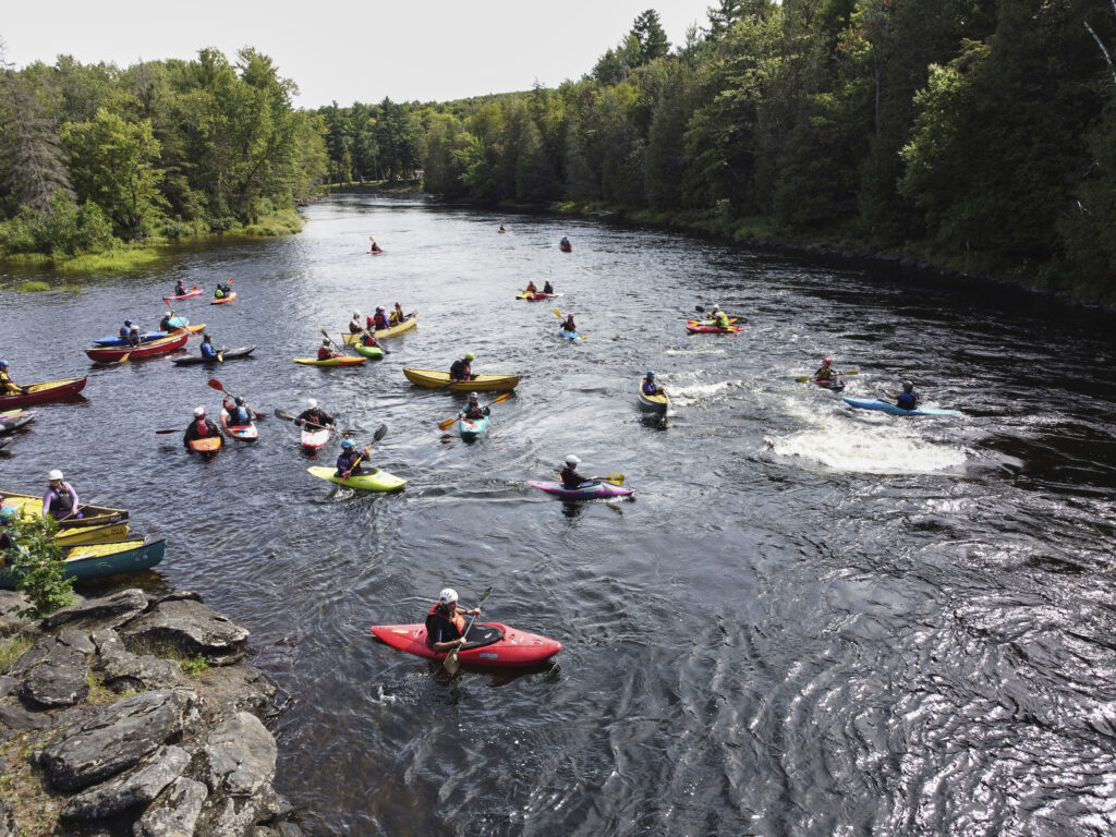 Paddlers playing at Claudia's roller madawaska river whtiewater